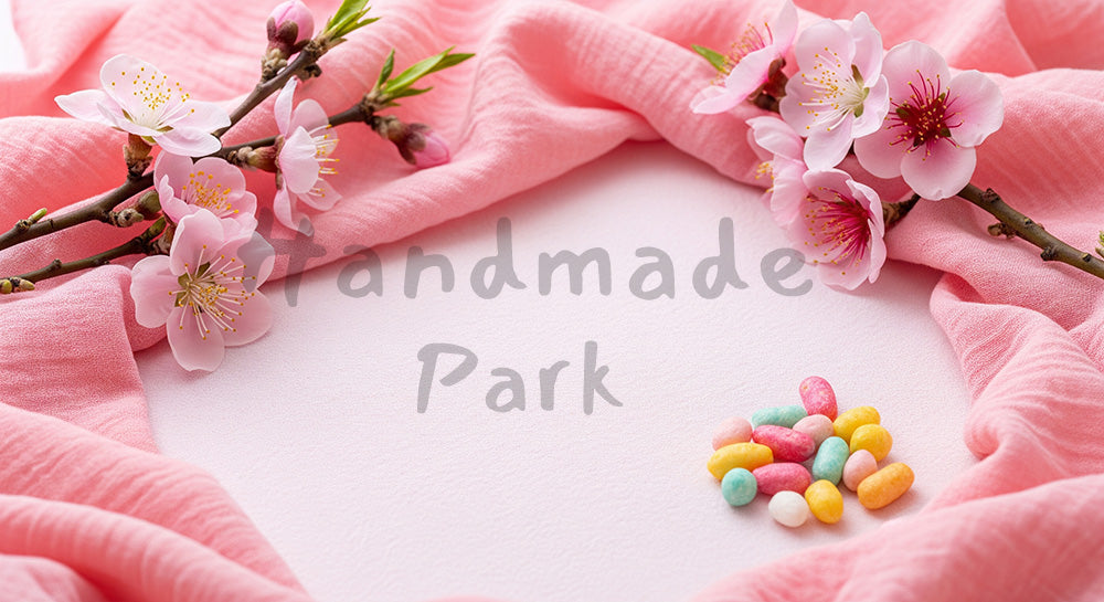 フリー素材 無料 写真|淡い桃色布の春背景 ひなあられアクセント|テキストを載せやすい余白背景