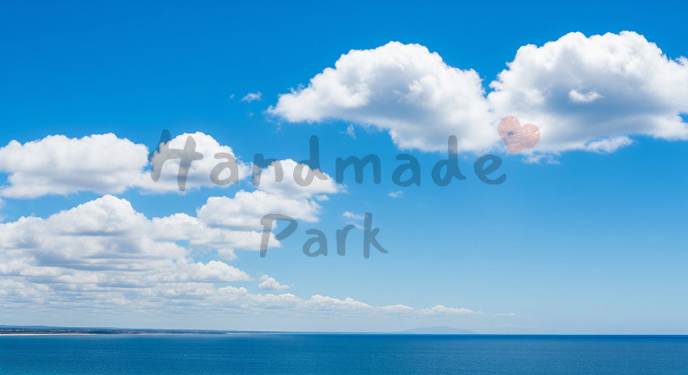 フリー素材 無料 写真｜青空と積雲、遠景に海が広がる爽快な風景背景写真
