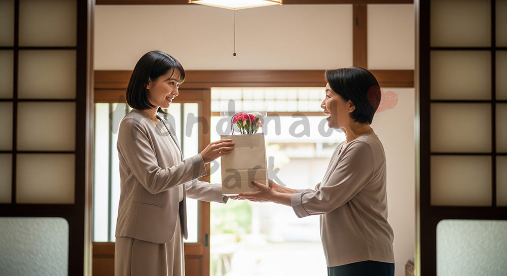 フリー素材 無料 写真｜母の日 ミニマルな 帰省の手土産とカーネーション｜SNS投稿のアイキャッチ向け
